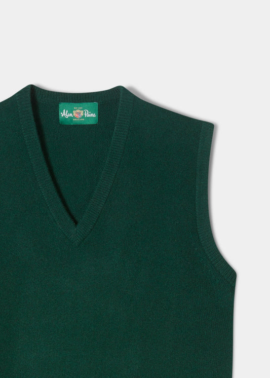 Norfolk Lambswool V-Neck Slipover In Tartan Green, a dark green knitted V-neck with an interior brand label at the collar.