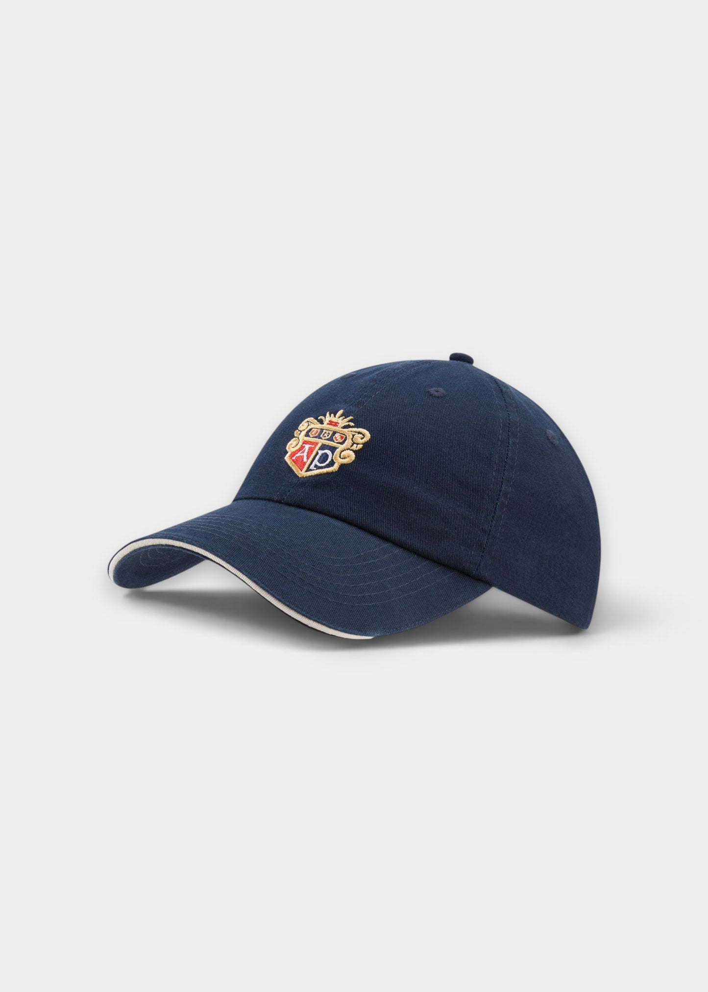 Alan Paine navy cotton baseball cap featuring an embroidered AP logo crest on the front and a contrast brim edge.