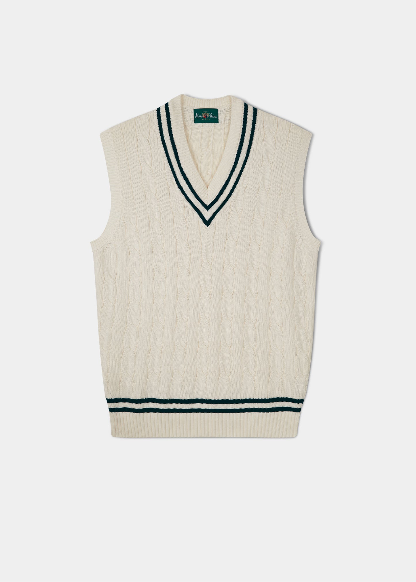 Cable knit slipover with an ecru base and dark navy trim.