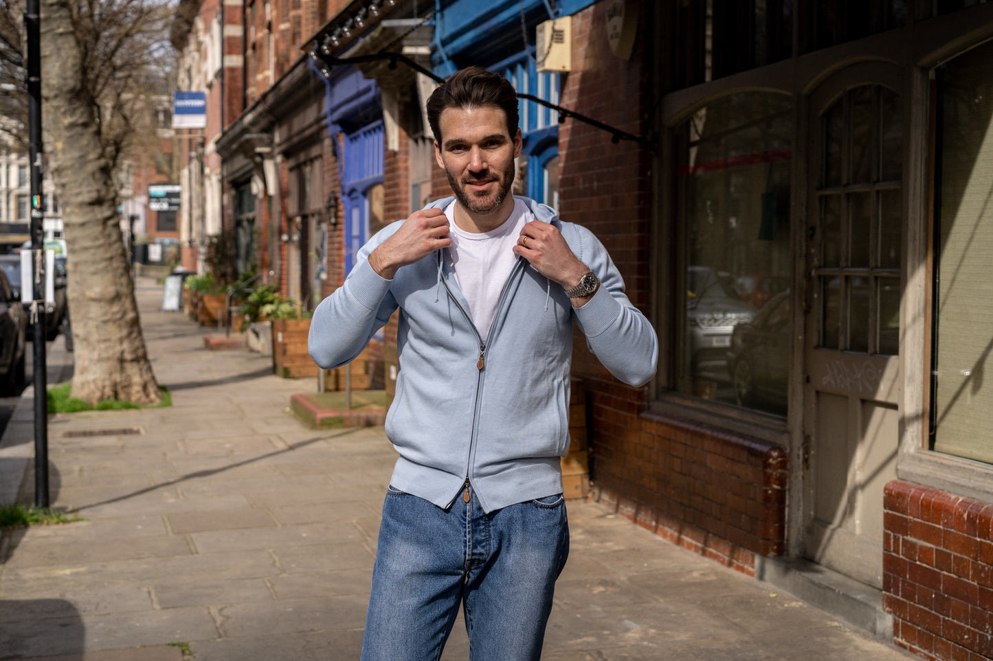 Cotton hoodie in bluebell with a front zip and side pockets.