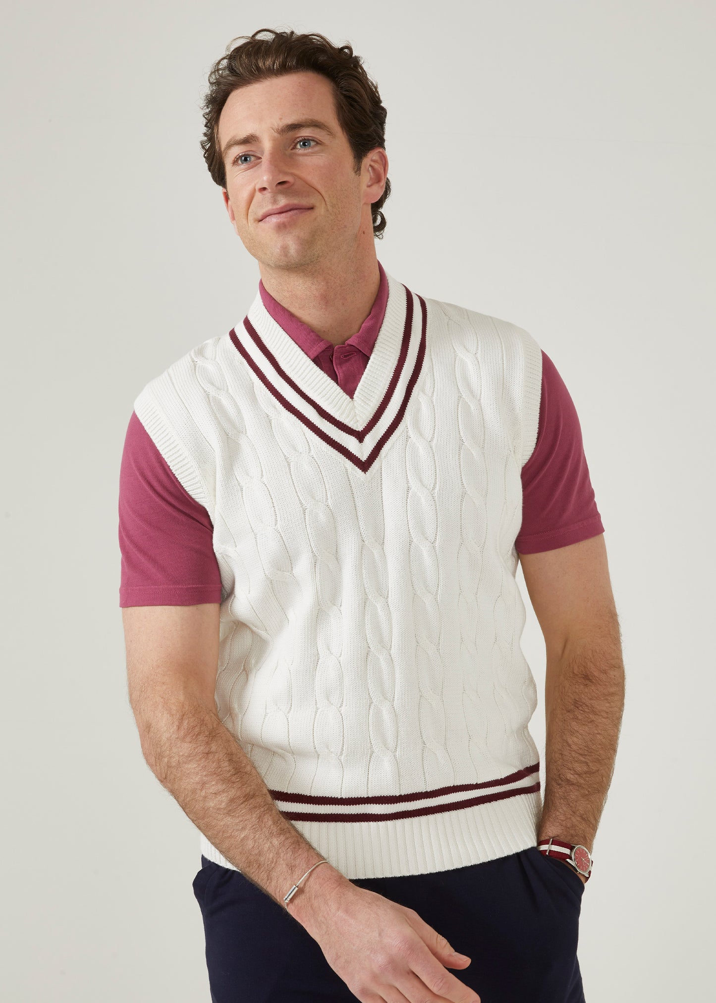 Ecru men's cable knit slipover in ecru with a claret trim.