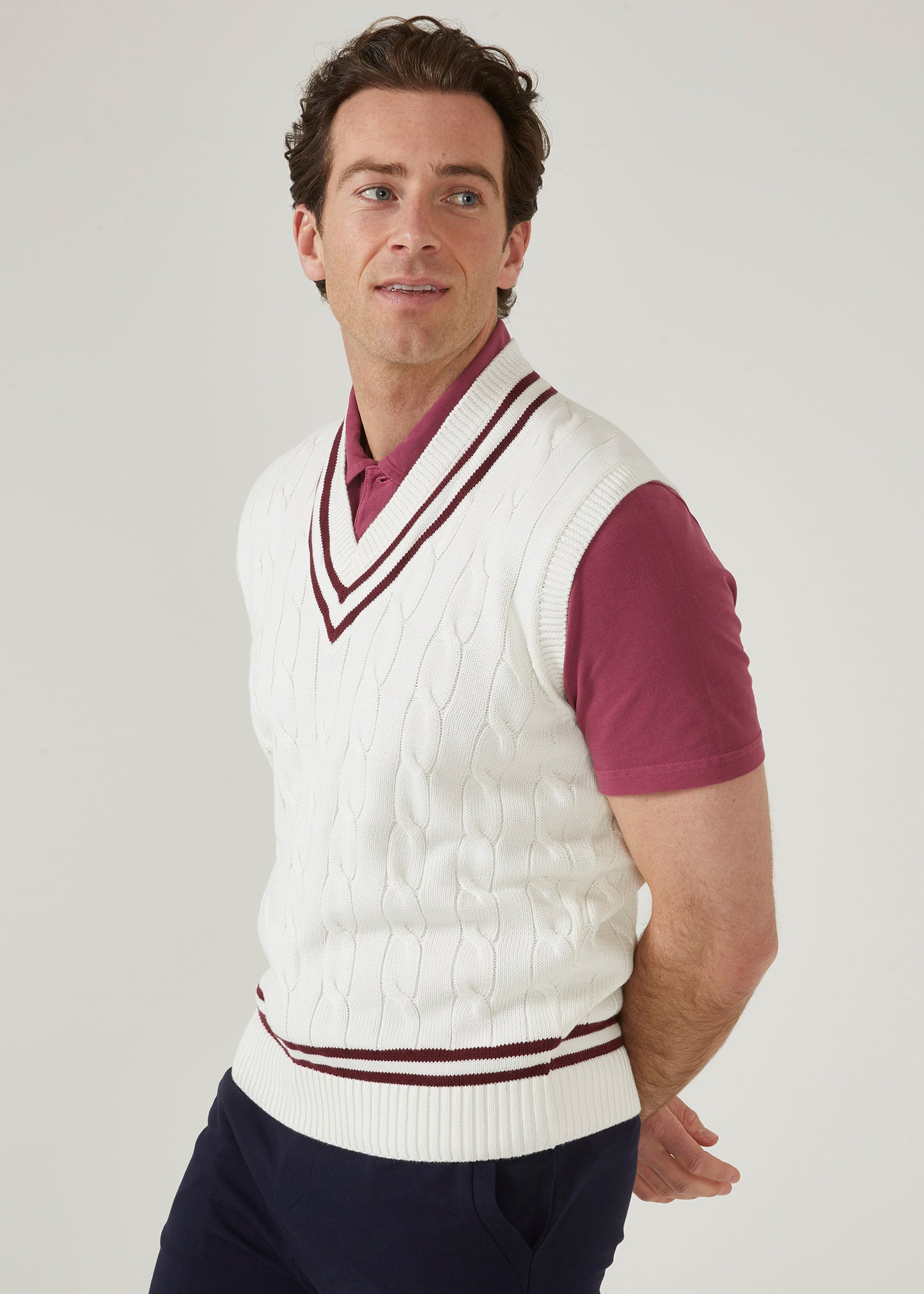 Ecru men's cable knit slipover in ecru with a claret trim.