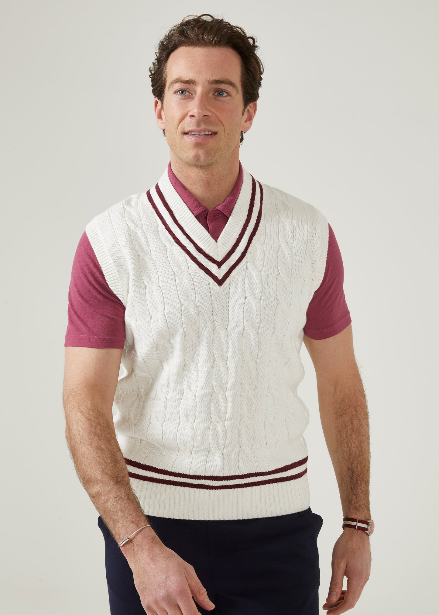 Ecru men's cable knit slipover in ecru with a claret trim.