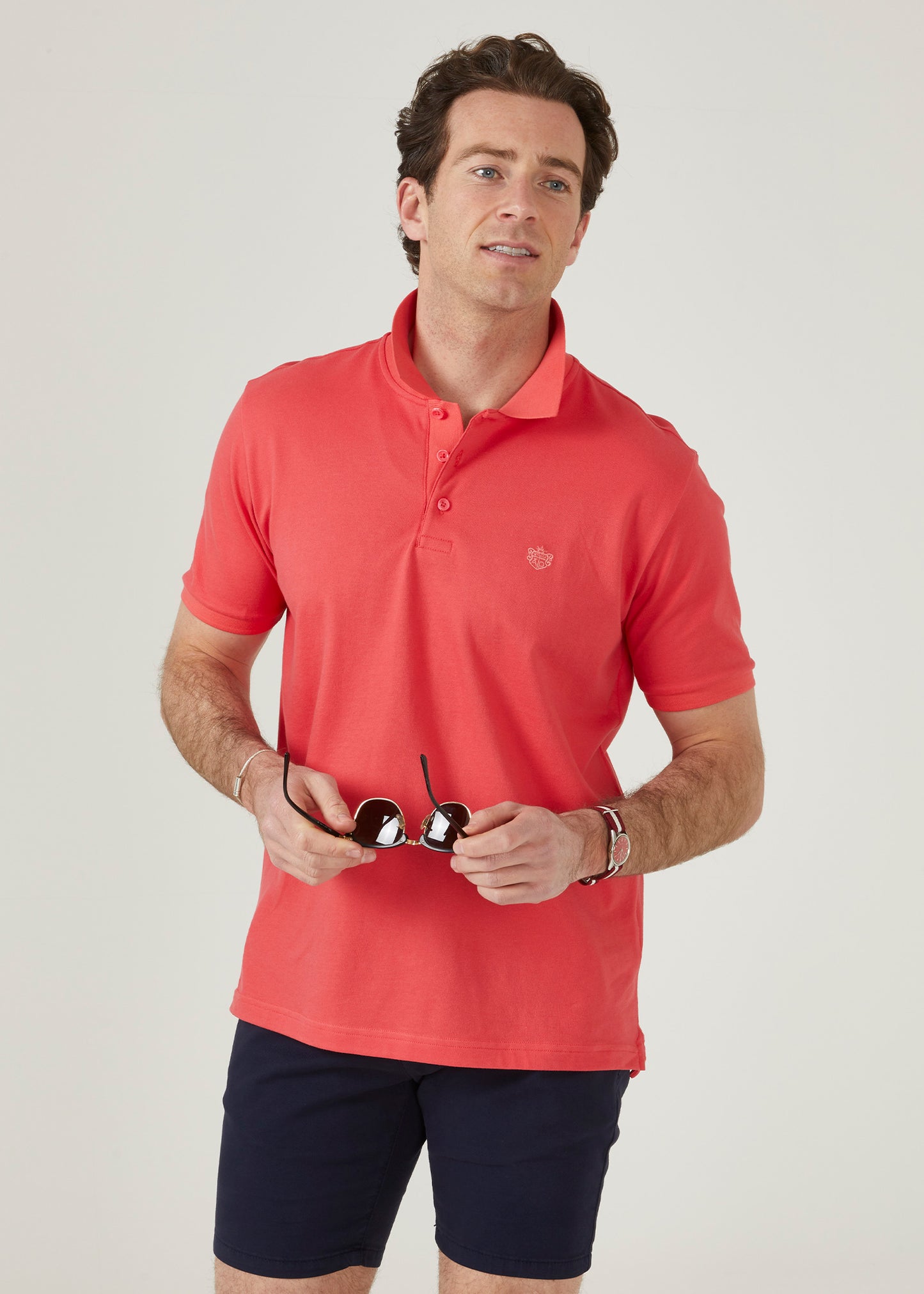 luxury pima cotton polo shirt with AP emblem in hibiscus pink.