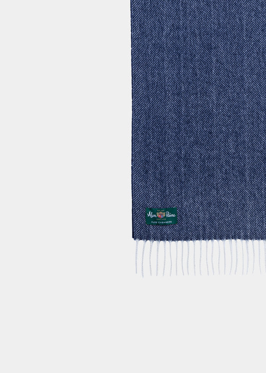 Kinross Cashmere Herringbone Scarf in Indigo with fringed ends and green label adds a touch of elegance.