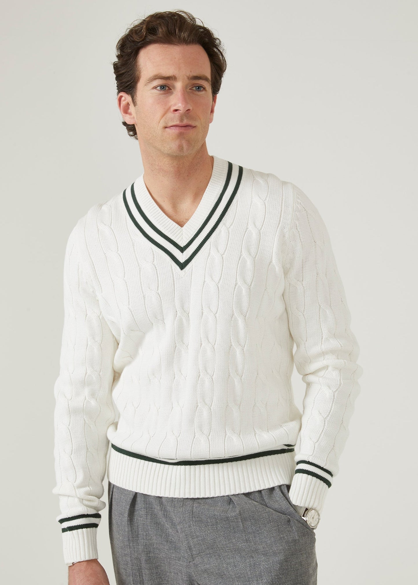 Ecru men's cricket jumper with racing green trim and a vee neck.