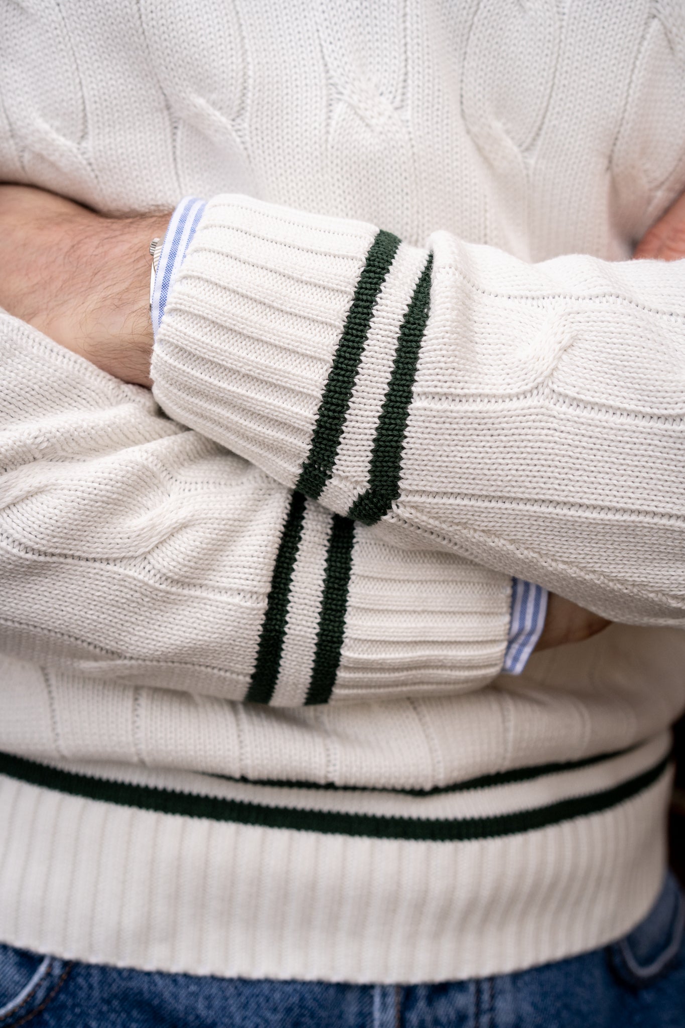 Ecru men's cricket jumper with racing green trim and a vee neck.