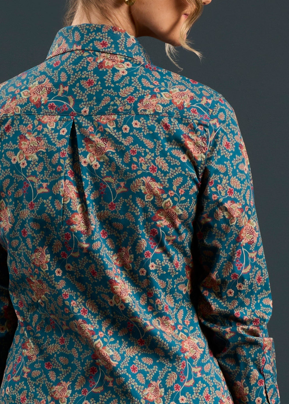 Model shows the Lawen Cotton Printed Shirt in Blue Floral Design, photographed from the back against a dark background.