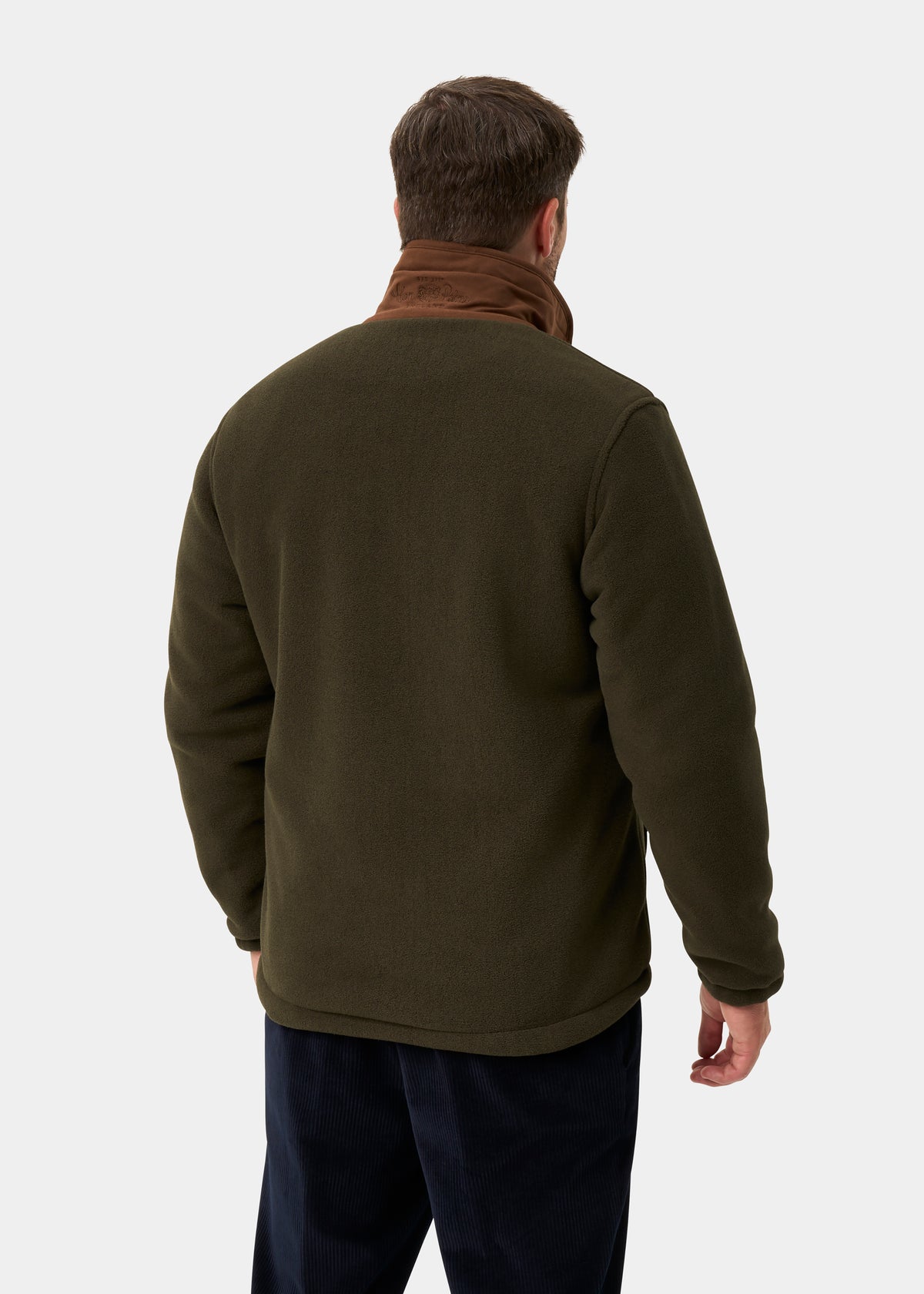 Man in green Aylsham Men’s Fleece Windblock, regular fit, and brown scarf, shown from the back on plain light background.