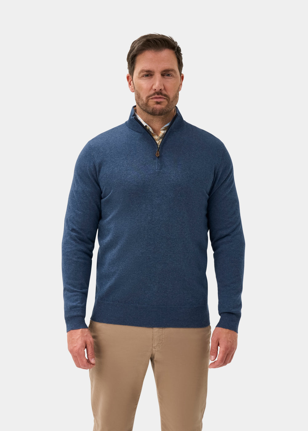 Man in Ashfield Cotton Merino Quarter Zip Jumper in Denim, Regular Fit, and khaki pants on a white background.