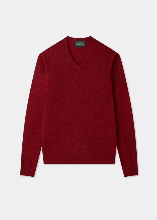 The Hampshire Lambswool Vee Neck Jumper in Poppy, classic fit, is laid flat on a white background.