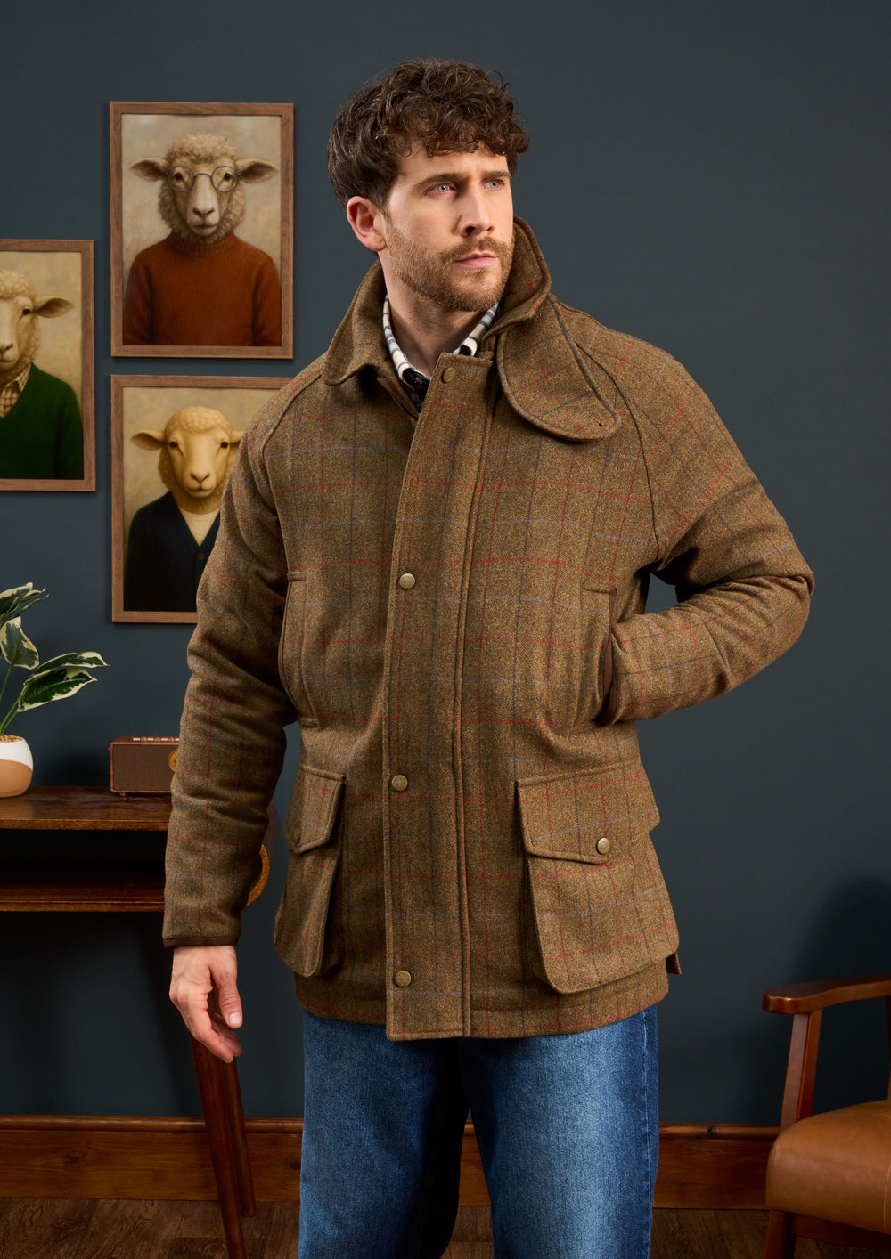 Man wearing a Surrey Men’s Tweed Waterproof Coat in Hawkswood, a brown plaid tweed shooting jacket with pockets and collar.