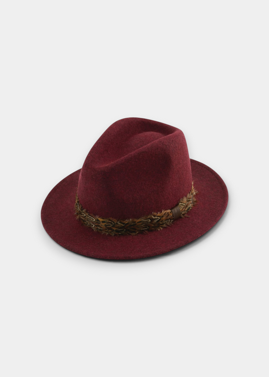 Ruby red felt fedora hat with a braided dark brown band and a medium brim.