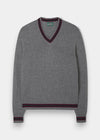 Alan Paine grey lambswool V-neck sweater with heritage-coloured trim on the collar, cuffs, and hem.
