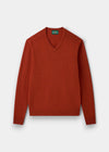 Alan Paine Kilsyth V-neck jumper in ember orange lambswool with ribbed hem and cuffs and saddle shoulder detailing.