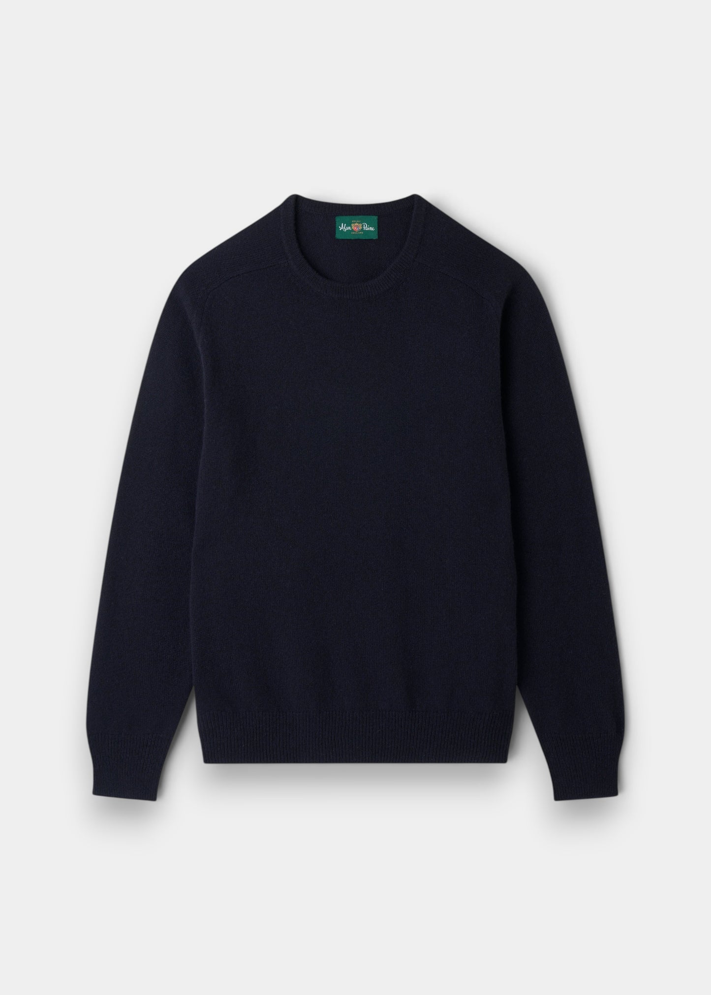 Alan Paine navy crew neck jumper in soft lambswool with ribbed hem and cuffs and semi-saddle shoulder shaping.
