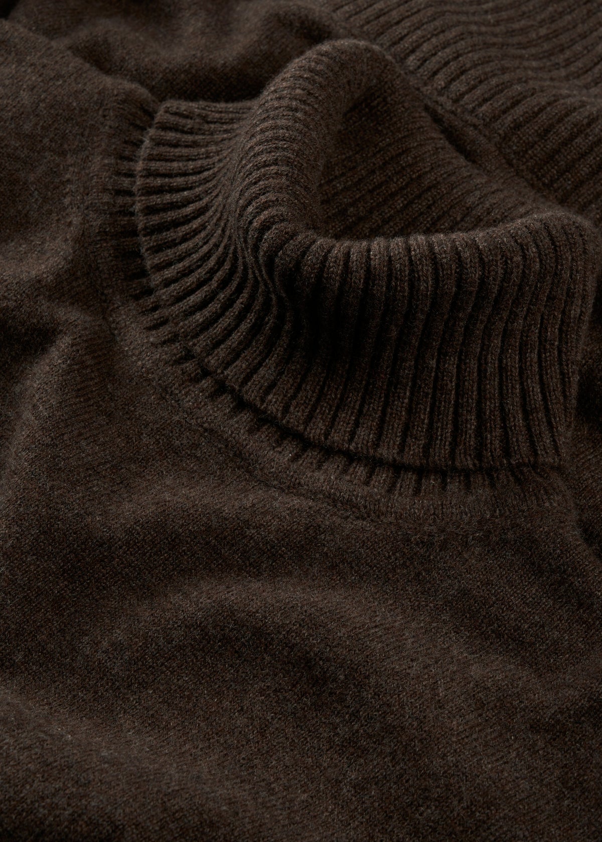 Close-up of the Alexa Wool & Cashmere Roll Neck Jumper in walnut, showing its soft texture and ribbed knit detail.