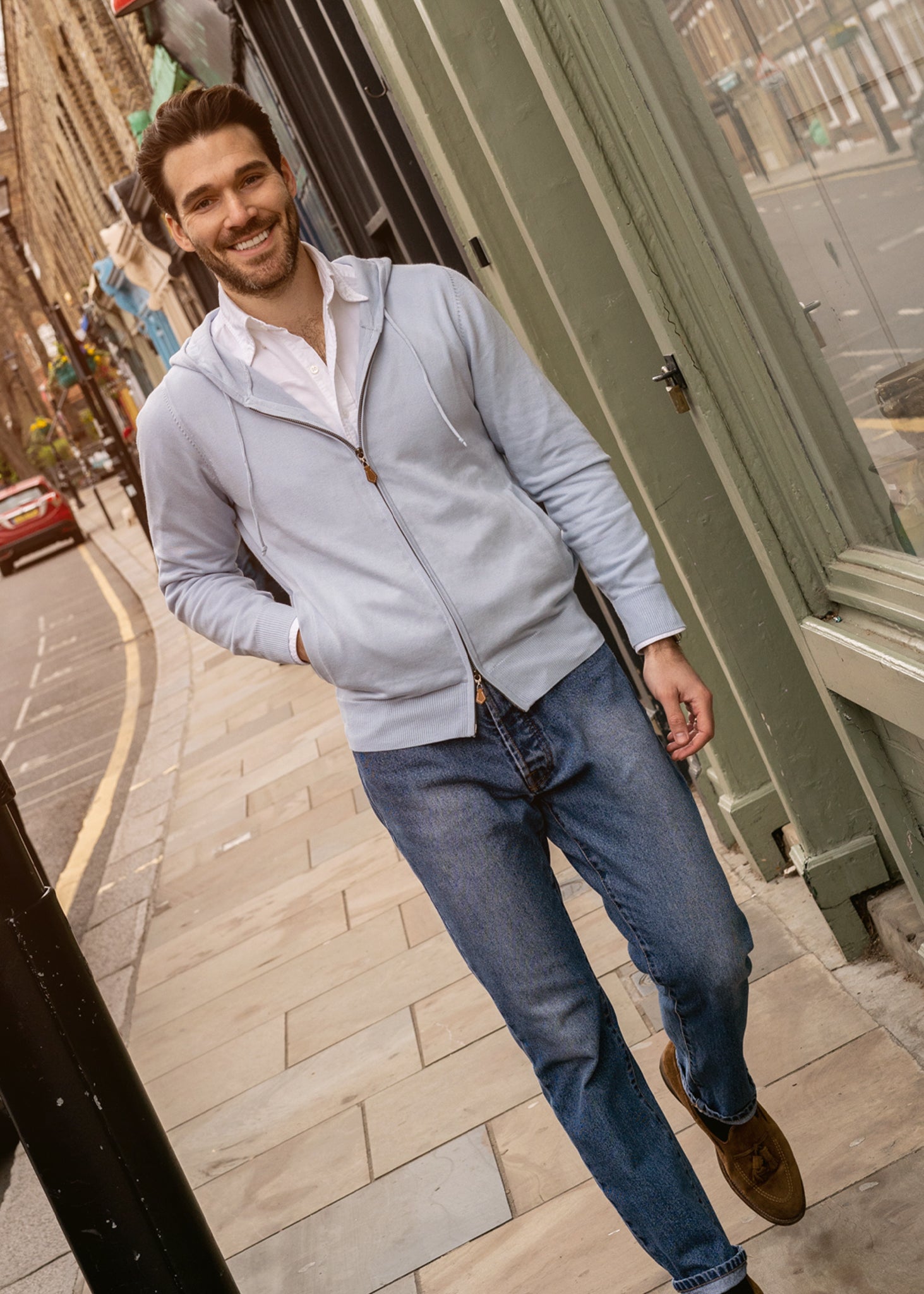 Cotton hoodie in bluebell with a front zip and side pockets.