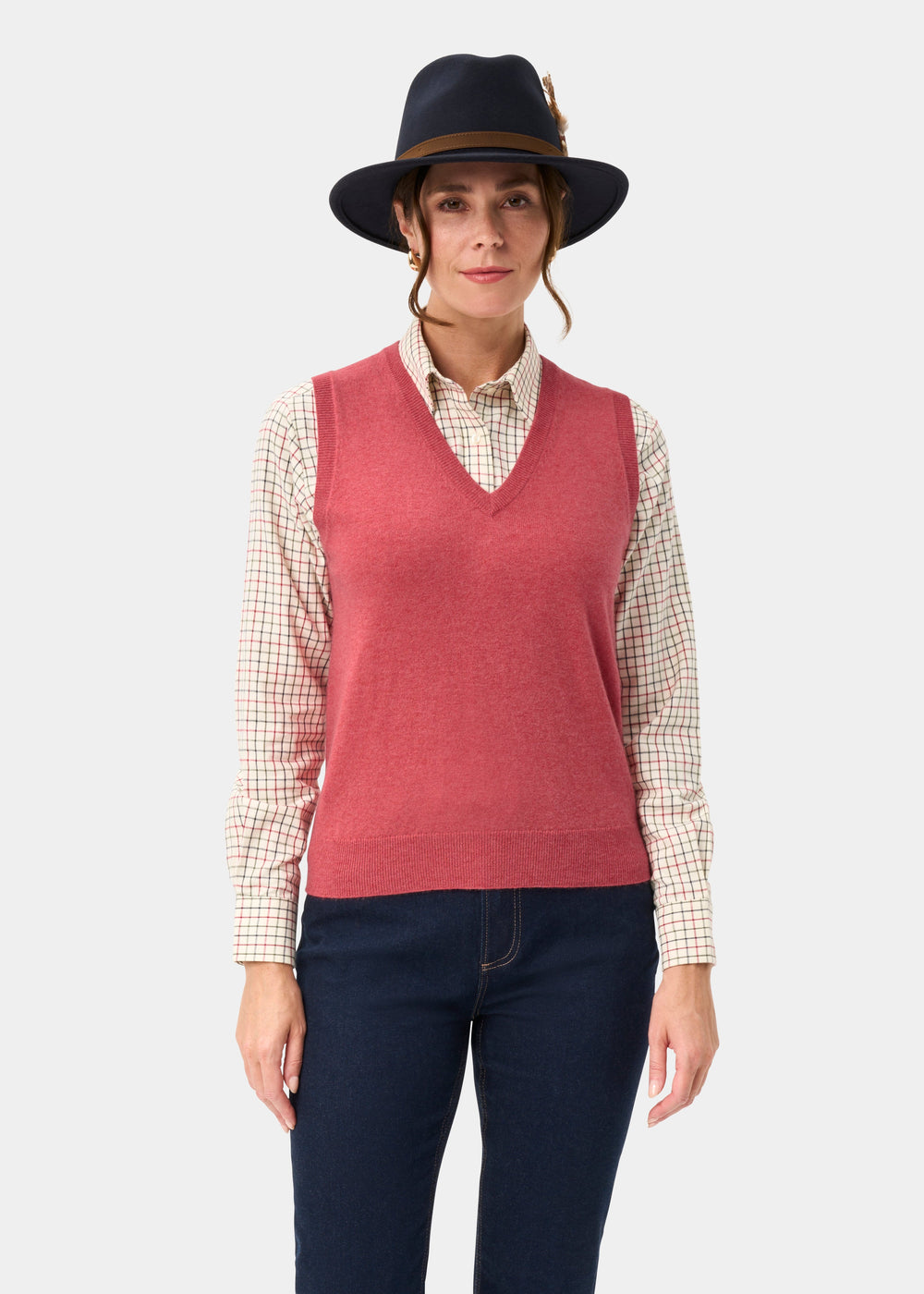 Woman in an Erin Wool & Cashmere V-Neck Slipover in Rouge stands against a light background.