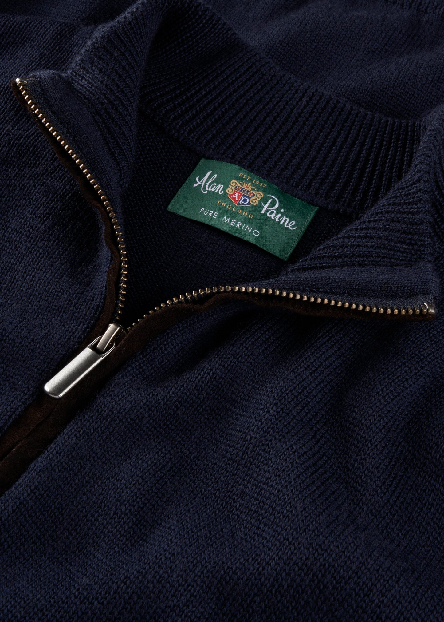 Navy sweater with a brand label
