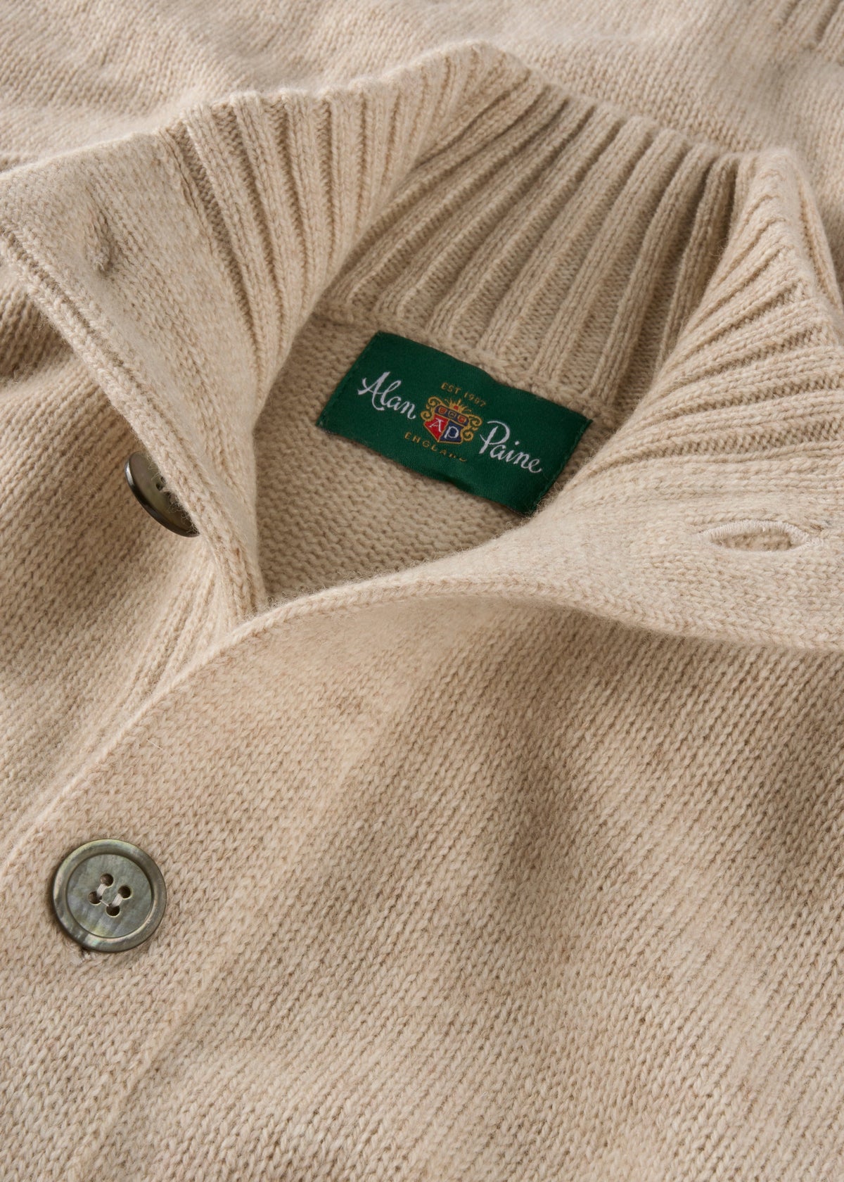 Landford lambswool buttoned mock neck jumper in linen, regular fit, with ribbed collar and green Alan Paine label.