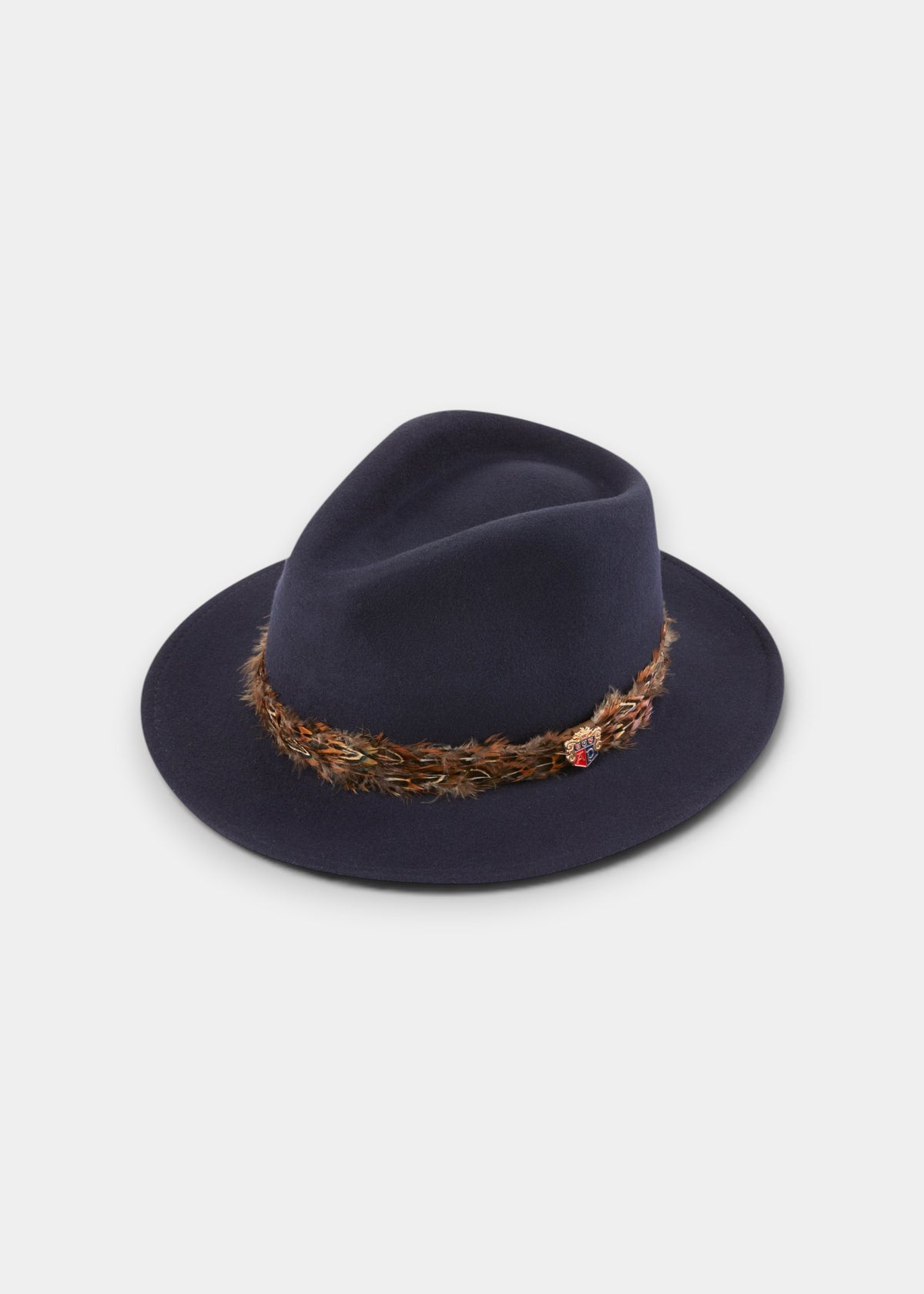 Richmond Ladies Fedora In Navy: a wool felt fedora featuring a pheasant feather band and a small crest pin.
