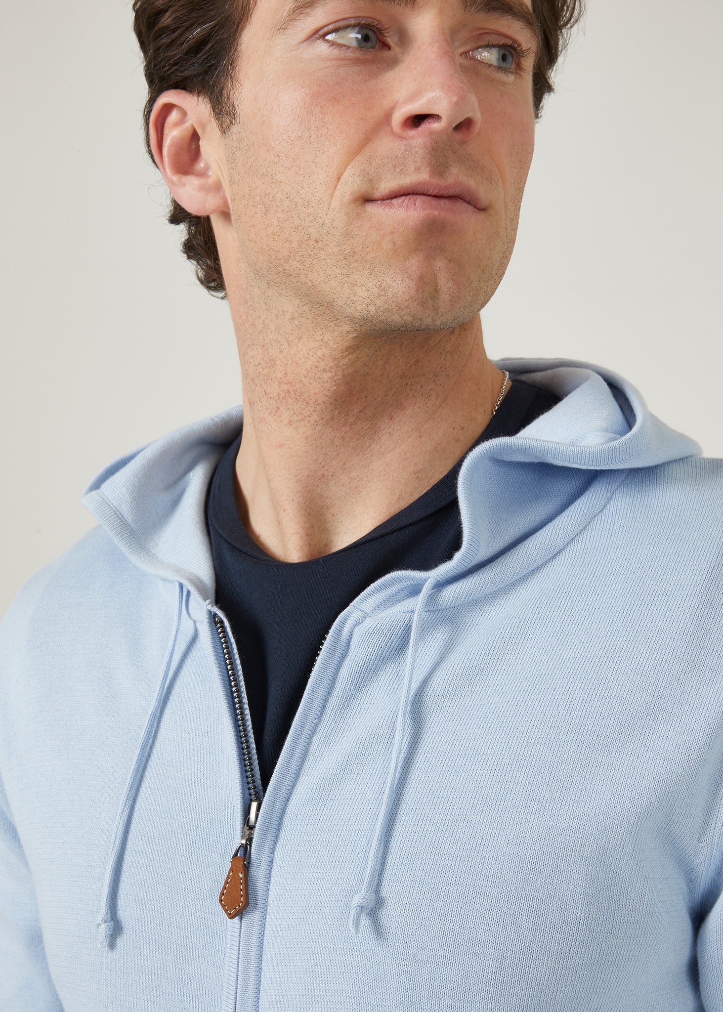 Cotton hoodie in bluebell with a front zip and side pockets.