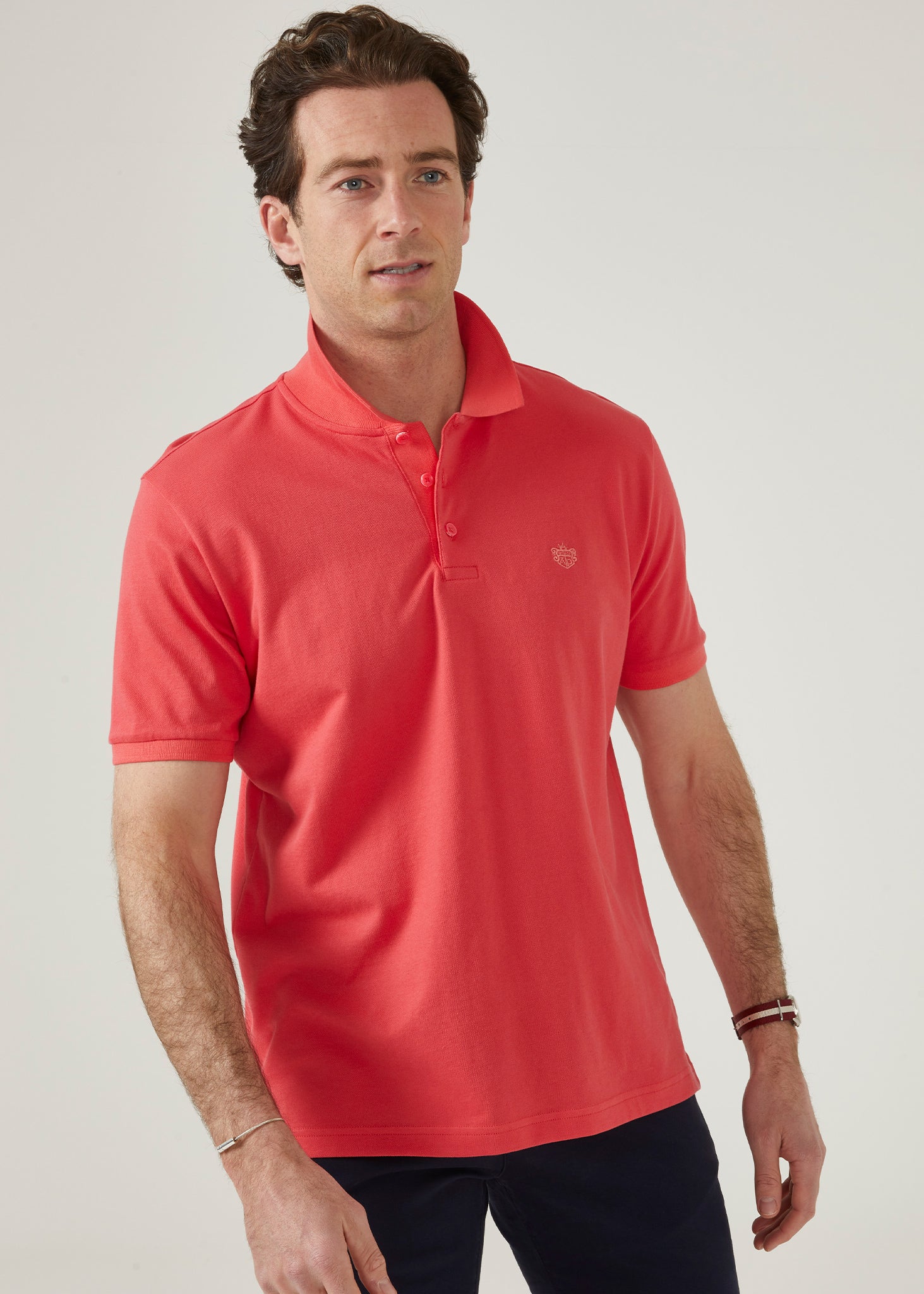 luxury pima cotton polo shirt with AP emblem in hibiscus pink.