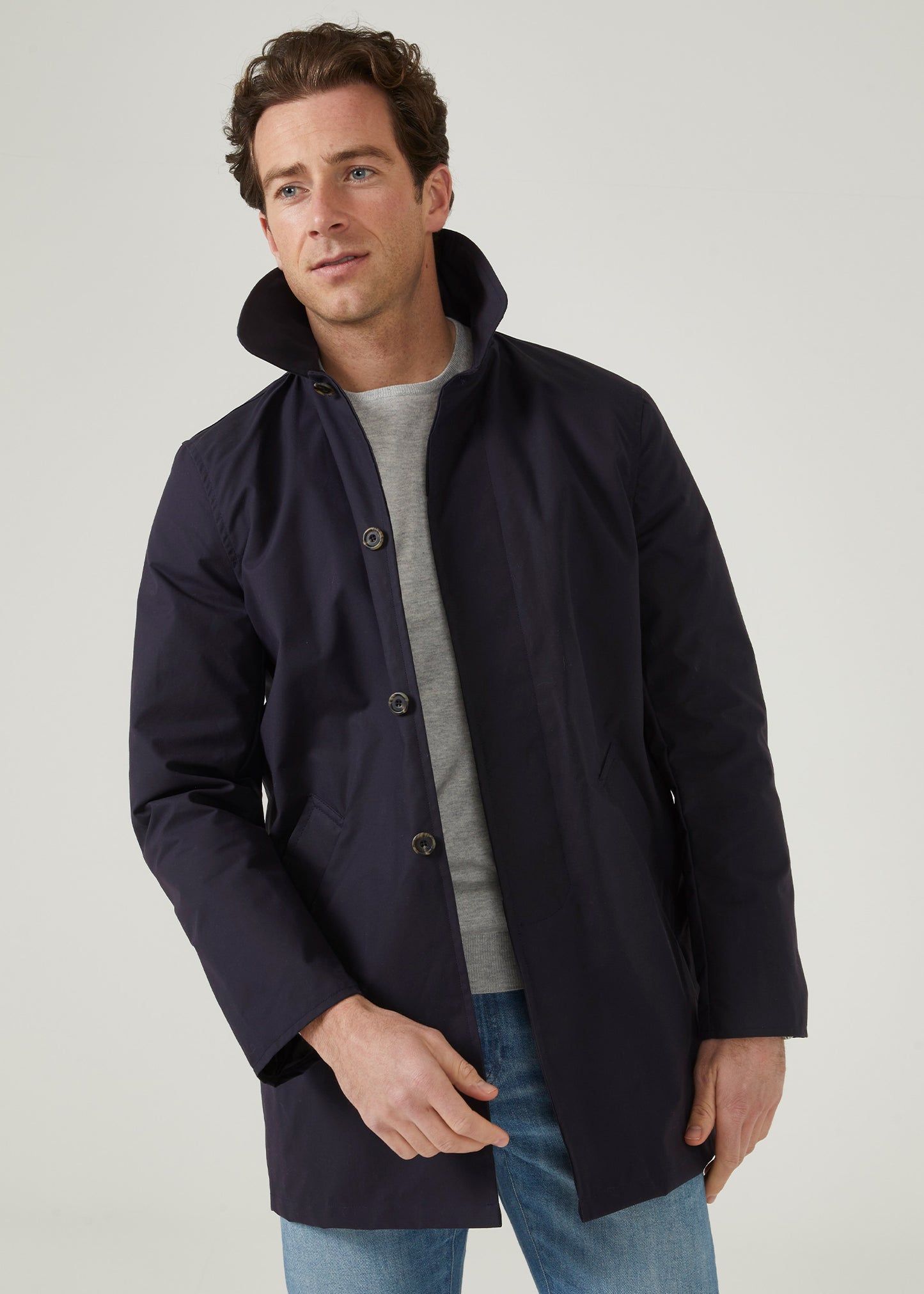 100% cotton showerproof raincoat in navy.
