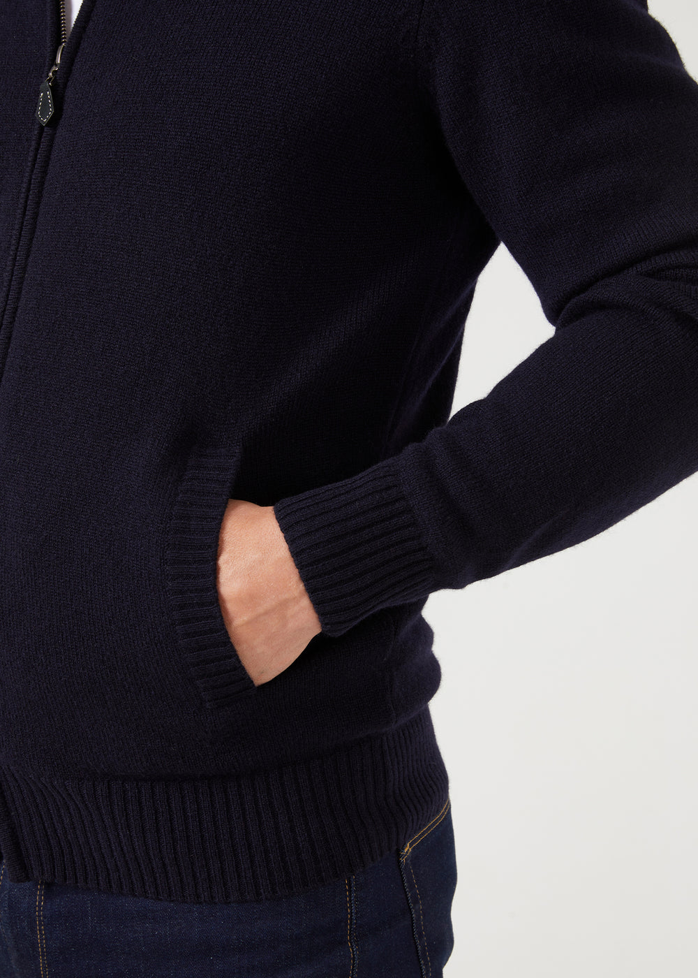 Model wears Ballater Lambswool Zip Mock Neck Jumper in Navy, regular fit, hand in pocket, shoulder to hip view.