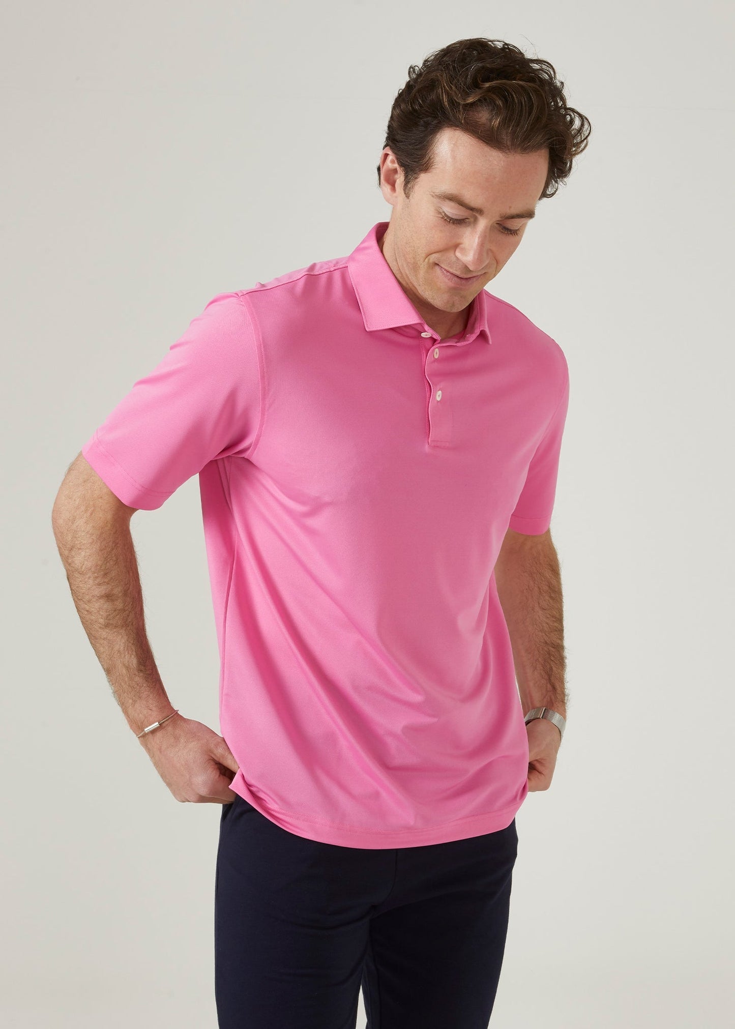 Men's 3 button polo shirt in carnation pink.