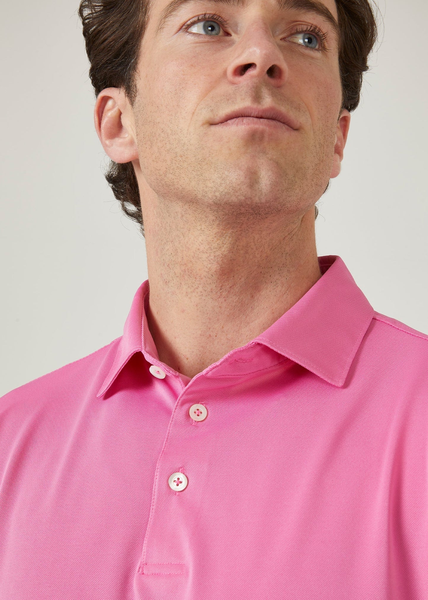 Men's 3 button polo shirt in carnation pink.