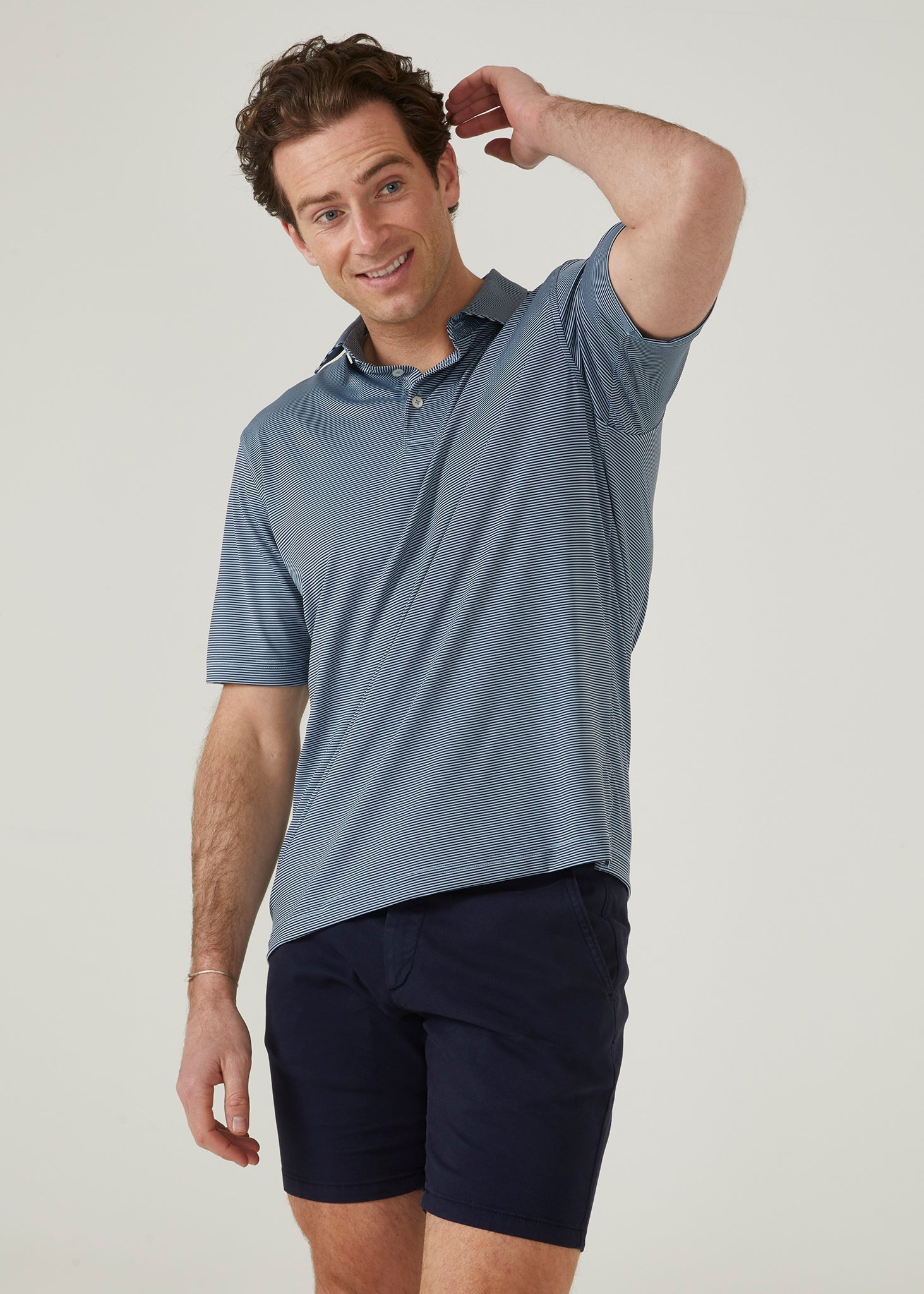 3 button short sleeve polo with Navy & light blue stipes.