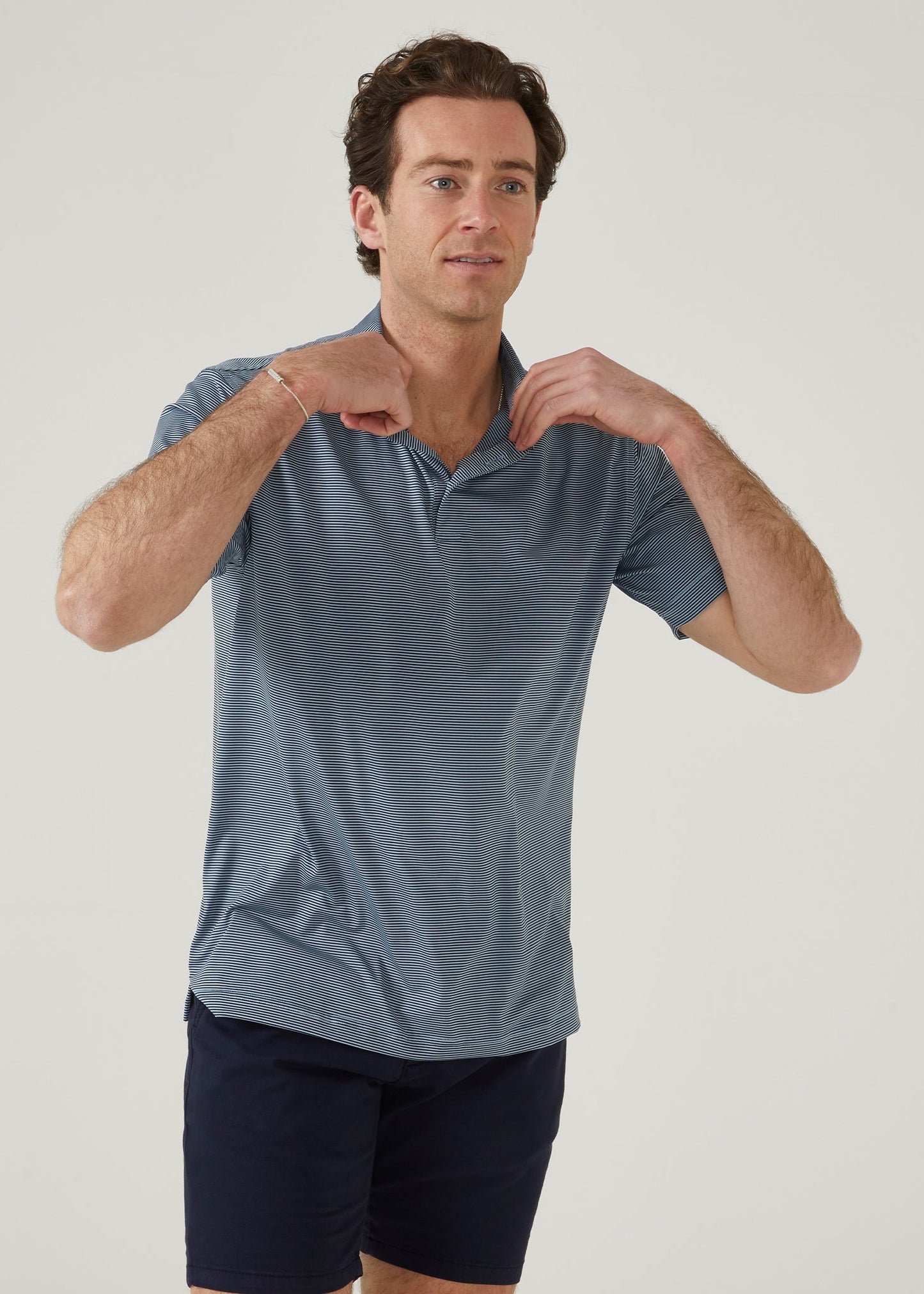 3 button short sleeve polo with Navy & light blue stipes.