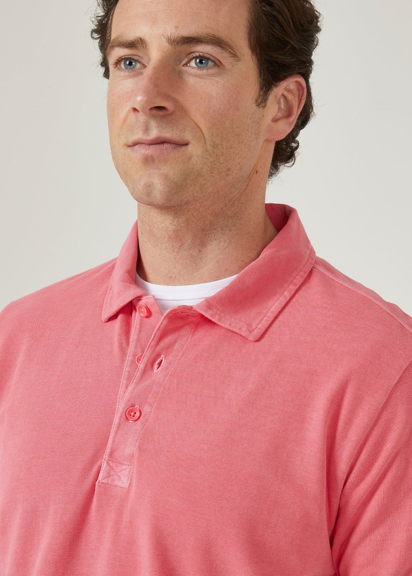 calypso pink polo shirt with short sleeves made from 100% preuvian cotton.